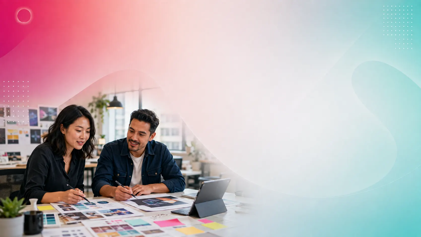 Two designers reviewing brand concepts at a studio worktable